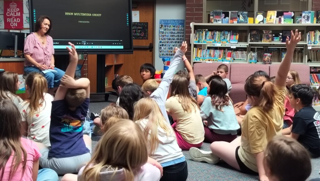 TR Fischer presents to elementary students during a school author visit
